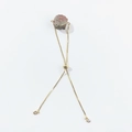 Detail of adjustable gold box chain bracelet with raw pink natural crystal stone - Unakite