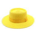Close-up of bright yellow straw hat showing fine woven texture and matching ribbon trim - Yellow