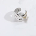 Silver vintage cross ring with golden leaf pattern detail on a textured white surface - Crossing Type / Silver