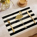 Elegant table setting with gold flamingo placemat, cutlery, and coffee on linen - Golden Flamingo Black White Stripes