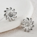 Irregular silver flower stud earrings with a sparkling central cubic zirconia stone - Starburst Rhinestone Style (JZE847-01)
