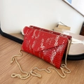 Red crocodile texture envelope bag with white patterns and a gold chain strap - Red