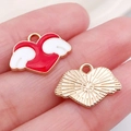 Antique silver angel heart pendant with red enamel and white wings in hand - Red Heart Wings (14972)