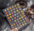 Detailed macro view of 3D embossed nail stickers featuring colorful sun flowers and smileys - Sunflower Embossed Smile Face (to574)
