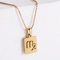 Detailed view of gold plated Virgo zodiac pendant with elegant bead chain on white block - Virgo