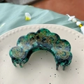 Detail of dark green marble acetate hair claw with gold cloud patterns and rhinestones - Rhinestone Hair Claw / Peacock Teal
