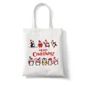 White canvas tote bag featuring cute penguins and red Merry Christmas text print - C3 Christmas Penguins