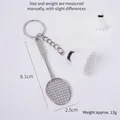 Mini silver alloy badminton racket keychain with a white shuttlecock accessory - White Shuttlecock (White Head) + Racket