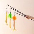 Three cat wands with colorful feathers, ribbons and bells for interactive pet play - Feather Ribbon