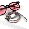 Detail of colorful bohemian braided eyewear strap with silver metal and black silicone loops - Size 22