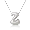 Detailed macro view of 3D puffed letter Z pendant on a silver necklace with mirror reflection - Letter Z