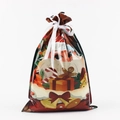 Christmas drawstring gift bag featuring Santa Claus and gingerbread man patterns - Gifting Santa / 29x43cm