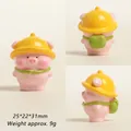 Detailed views of a cute pink resin pig wearing a yellow hat and green backpack - Green Backpack Pink Pig