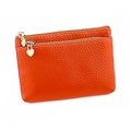 Close-up of orange genuine leather coin purse with double zippers and heart puller - Orange