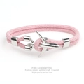 Pink braided Milan rope bracelet with a silver aircraft charm on a white background - Pink Rope Silver Airplane