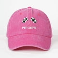 Close-up of pink cotton baseball cap featuring Pit Crew text and racing flags detail - Rose Red