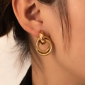 Elegant 18K gold-plated stainless steel layered hoop earrings shown on a model - Gold Double Ring Texture (BJGE0715)