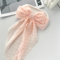 Pink oversized bow hair clip with white polka dots and long flowing tassel ribbon - Light Pink
