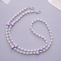 Close-up of heart beads and imitation pearls on a purple and white phone lanyard - Purple Heart Crossbody Chain (K2047) / Purple