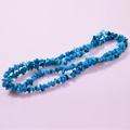 Irregular blue crystal stone beads for DIY jewelry making on pink background - Ocean Blue