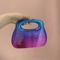 Acrylic evening clutch bag featuring a blue to purple gradient wavy textured shell - Colorful