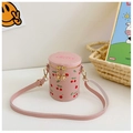 Detailed view of pink cherry print bucket bag for girls with zip and shoulder strap - Pink