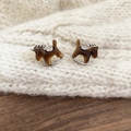 Macro shot of rocking horse stud earrings with amber resin and sparkling zircon stones - Silver Needle Stud / Silver-Coffee