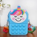 Blue unicorn pop-it fidget purse for kids with rainbow shoulder strap on wooden desk - Blue
