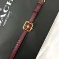 Detail of burgundy leather watch with gold clover dial in luxury gift packaging - Camellia Style-22055