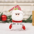 Tarro de dulces de Papá Noel con gorro de punto a rayas y caja de regalo transparente - Santa Claus