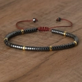 Adjustable woven bracelet with hematite beads and gold spacers on red cord strap - No.57 Hematite