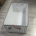 Foldable fabric storage bin in houndstooth pattern with brown reinforced handles - Coated Houndstooth With Steel Frame