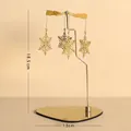 Goldenes rotierendes Schneeflocken-Windlicht mit herzförmigem Metallsockel - Fliegende Schneeflocke / Gold