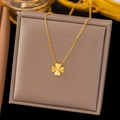 Elegant gold four-leaf clover pendant necklace with fine chain on jewelry display box - Four-leaf Clover (H359)