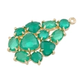 Detail of a pear-shaped copper pendant with green gemstones in a gold finish - Type L-Green