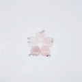 Set of five heart-shaped pink crystal pendants with silver metal clasps on white background - Rose Quartz