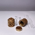 Detailed view of hand-carved sandalwood sachet pendant with brass accents and hollow design - Green Sandalwood Cylinder / Approx 2.8*2.2cm