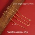 Twisted rope gold-plated necklace with S-hook clasp on a wooden background - 60cm Double Water Wave Chain (X2822)