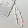 Detailed macro view of colorful heart charms and white beads on a portable phone wrist strap - White Polymer Clay Bead Lanyard