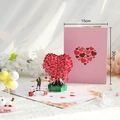 3D pop-up greeting card featuring a pink cherry blossom heart tree and romantic bridge - Heart Tree Couple