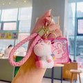 Porte-clés licorne blanche mignonne avec dragonne rose tressée et crochet doré - Rose