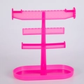 Three-tier bright pink plastic jewelry display stand for earrings and necklaces - Pink