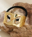 Detail of a gold chunky metal chain hair tie on a natural rock surface - Style 1-Chain Link Design / Gold