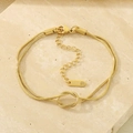 Close-up of a double-strand 18K gold plated snake chain bracelet with a central knot detail - Gold Knot Snake Chain Bracelet Style (KB185287-Z)