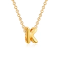 Detail of 3D bubble letter K pendant in gold finish with a polished surface - Letter K