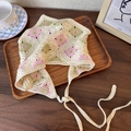 Close-up of cream handmade crochet headscarf with pink and green floral embroidery - Pink and Green Floral (24878A)