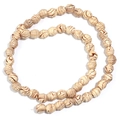 Detailed view of spiral wood grain resin beads in a unique pumpkin shape for DIY jewelry - 10x10mm / Brown