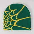 Deep green beanie with bright yellow spider web jacquard pattern on a grey background - Dark Green