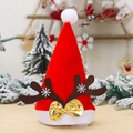 Cappello di Babbo Natale rosso con corna marroni e fiocco dorato in scena festiva - Corna Cachi Con Fiocco Dorato (J-CZ22) / Adulto