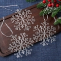 Three transparent acrylic snowflake ornaments with white ribbons on a rustic wooden tray - Snowflake 11CM (Set of 3)